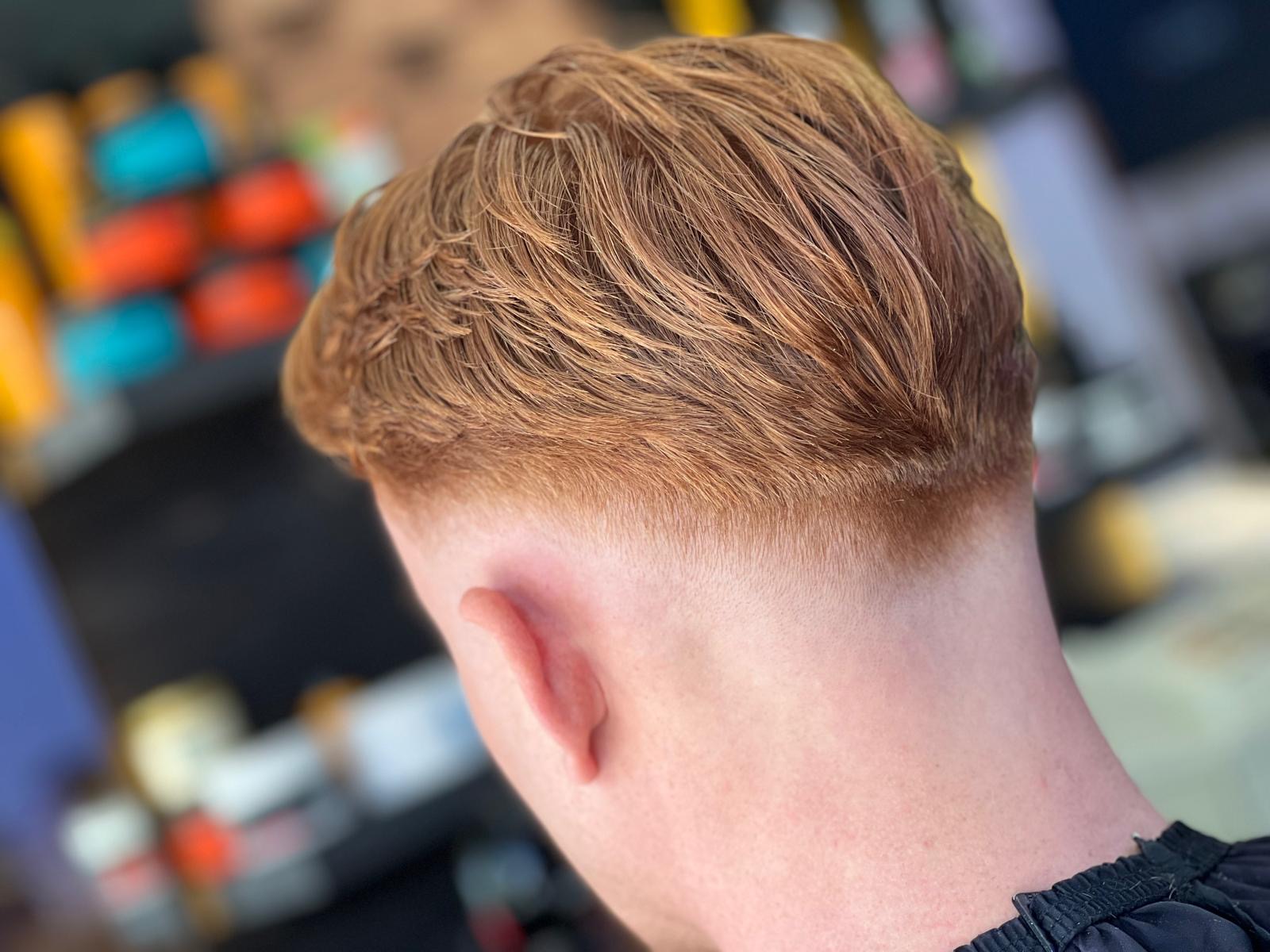 A short finished haircut with a neatly blended back