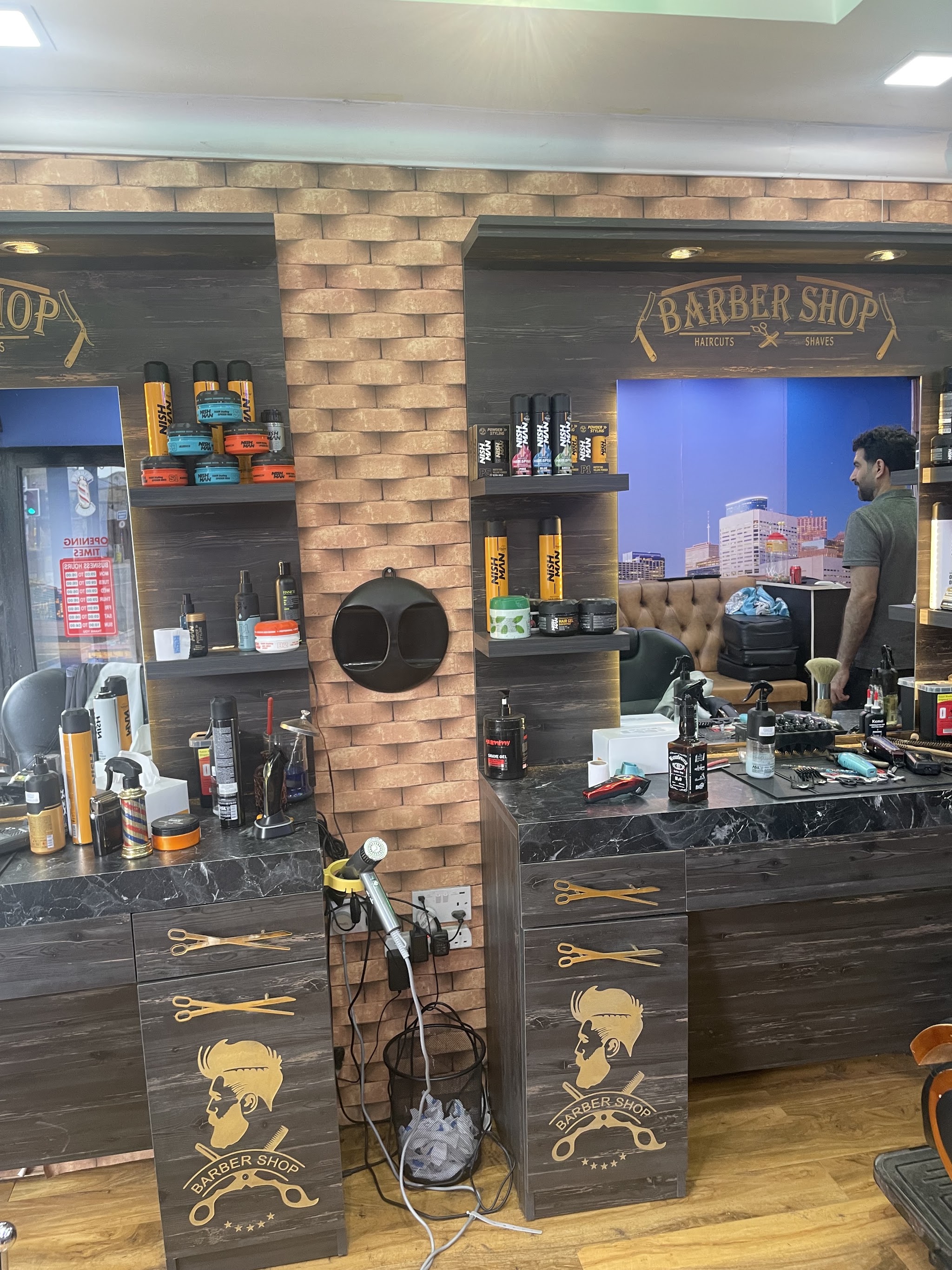 Brickwork, mirrors and barber stations inside the Crossgate shop